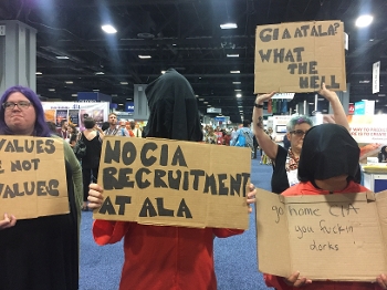 Organizers from Librarians for Democracy protesting the CIA booth at ALA